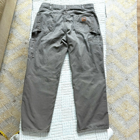 Carhartt distressed carpenter pants with some stains and holes. #10015 - Picture 6 of 11